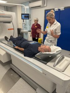 Viv Orme, Nuclear Medicine Lead, explains the procedure for the scan to patient Simon Burgess