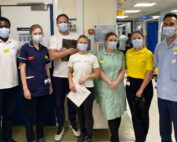 Christina Morgan and Iain Howard pictured with members of staff on Ward 27.